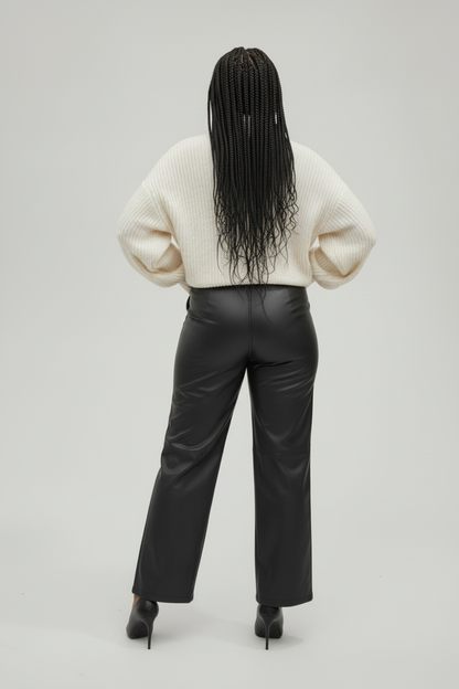 Mannequin de dos avec pull beige et pantalon noir